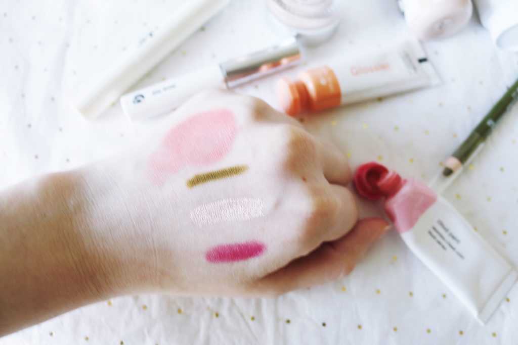 Glossier makeup swatches: Cloud Paint, Colorslide, Niteshine, and Vinylic Lip